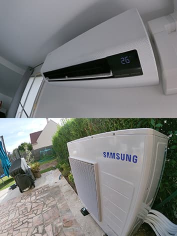 photo d'un climatiseur samsung blanc accroché au mur avec son moteur en bas